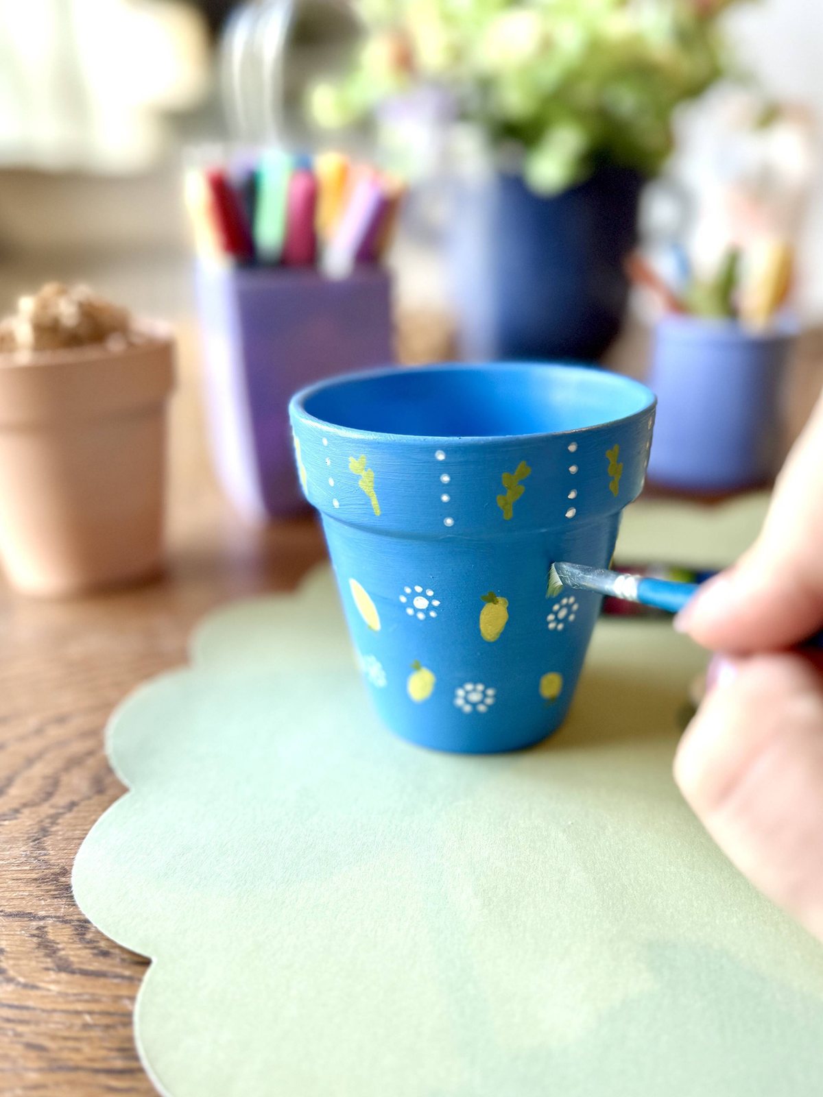 Hand-painted pots at a Patch Bar craft experience